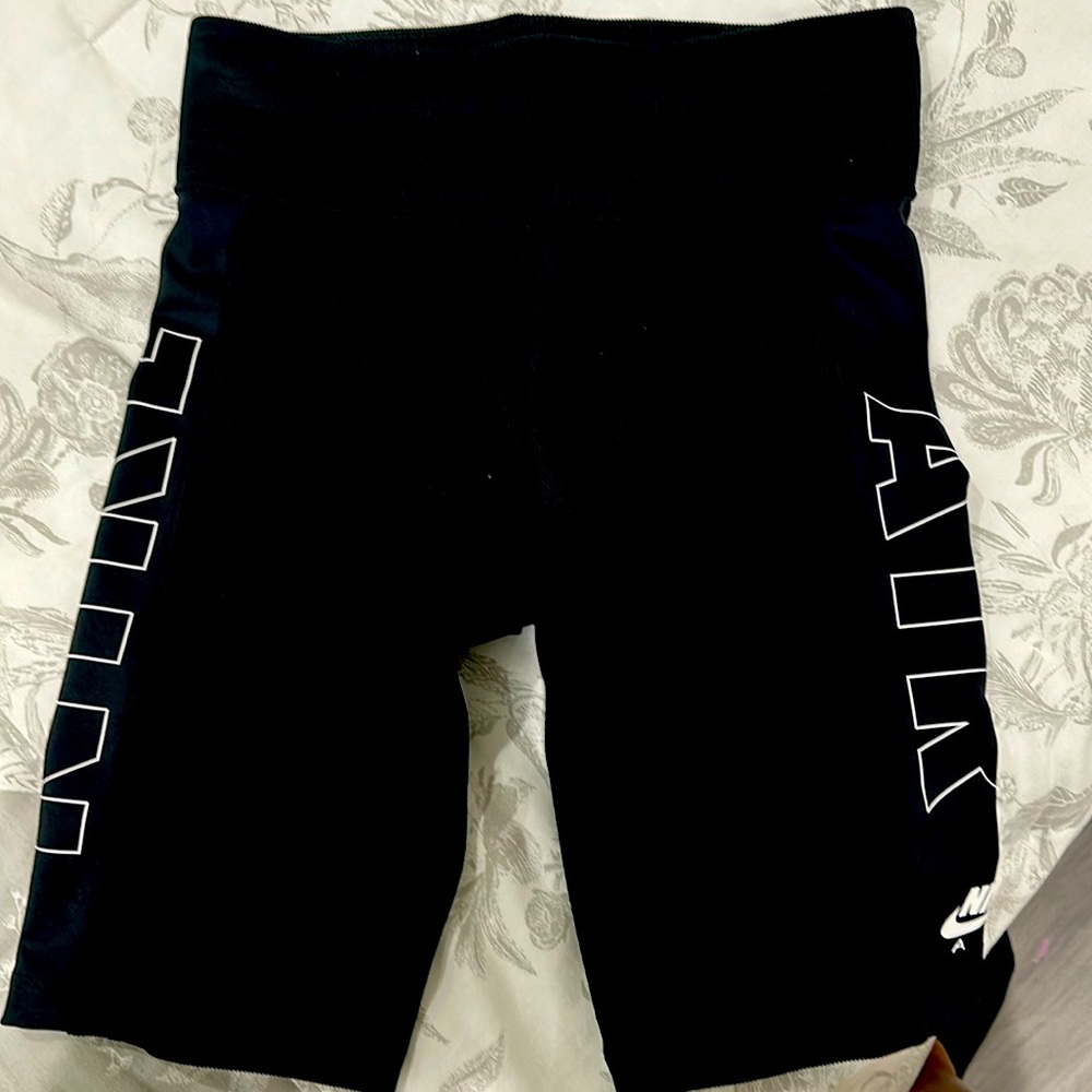 Nike shorts. Above the knee and high waisted.